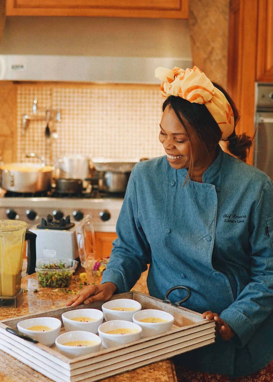 Chef plating a tasting course in the kitchen