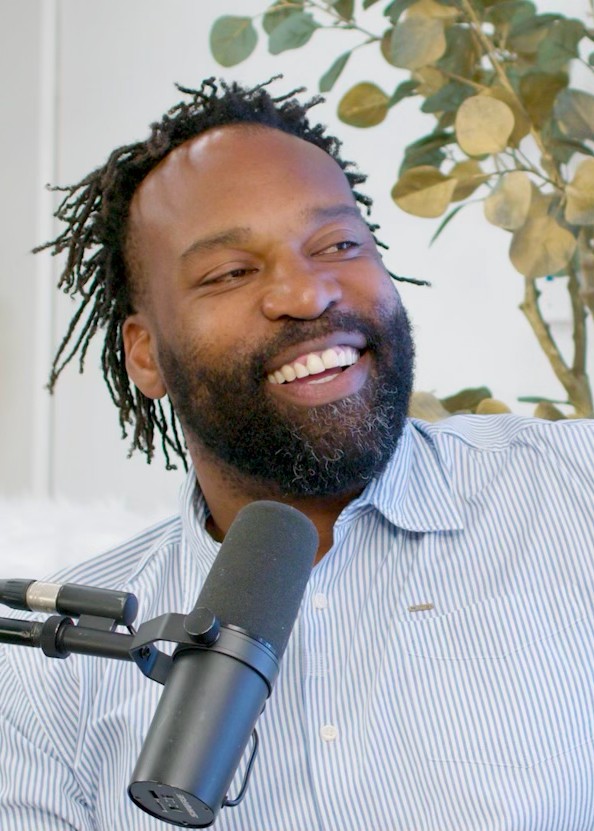 Founder speaking on a podcast microphone